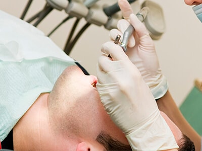 A specialist dentist placing dental implants 